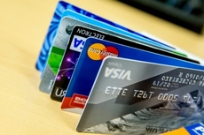 Где самые дешевые тарифы по картам Visa Infinite в тенге